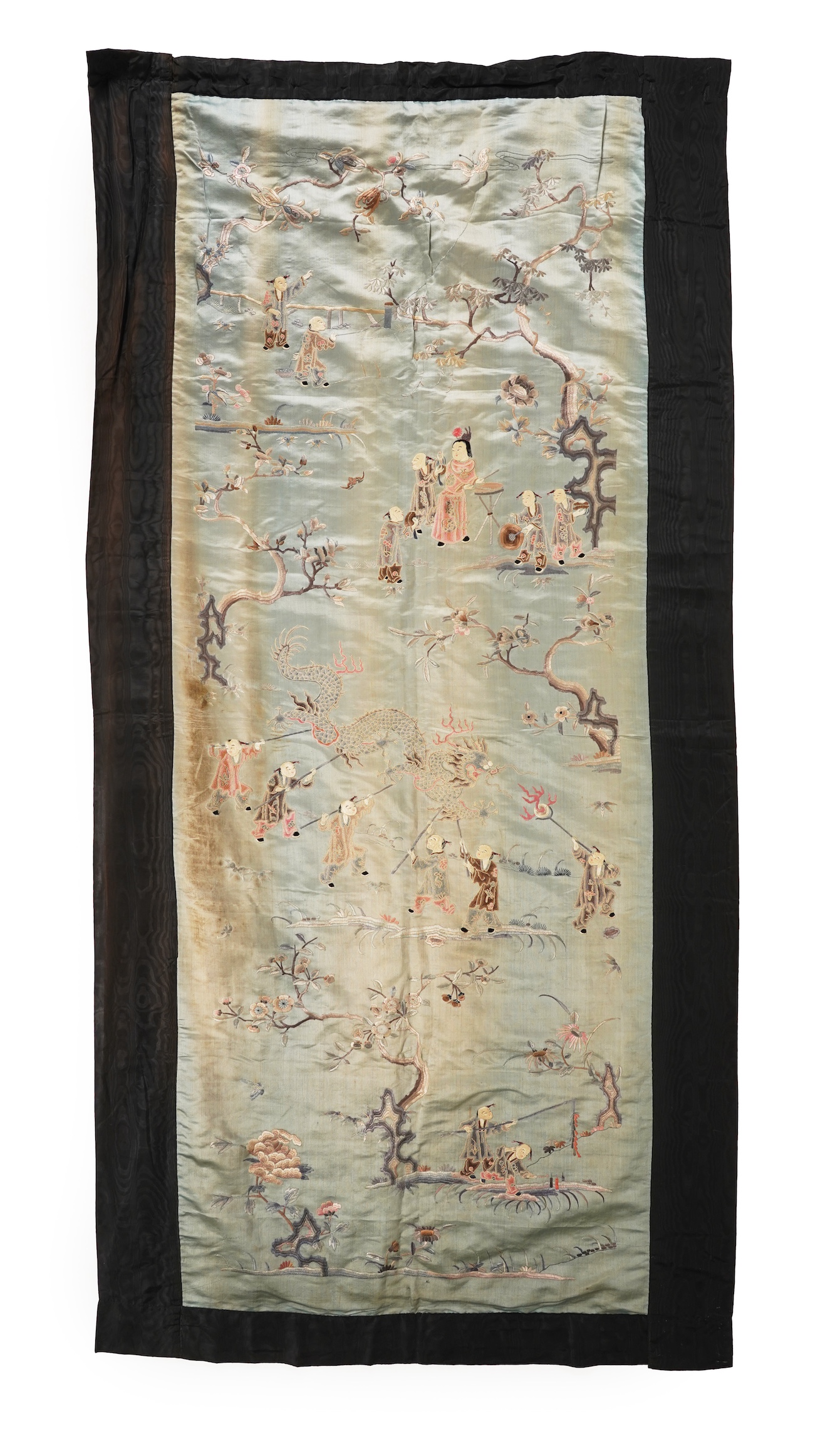 A Chinese embroidered silk ‘dragon dance’ panel, 18th/19th century